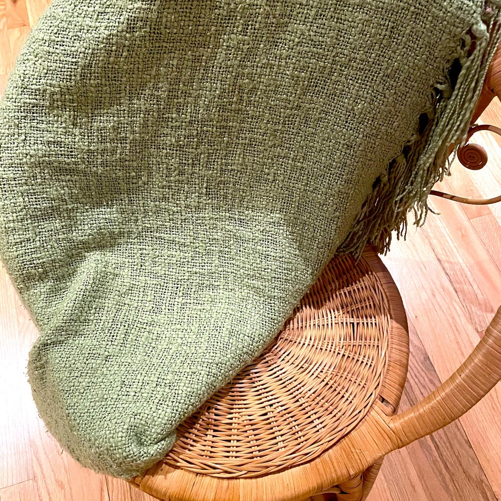 Pottery Barn green throw blanket.